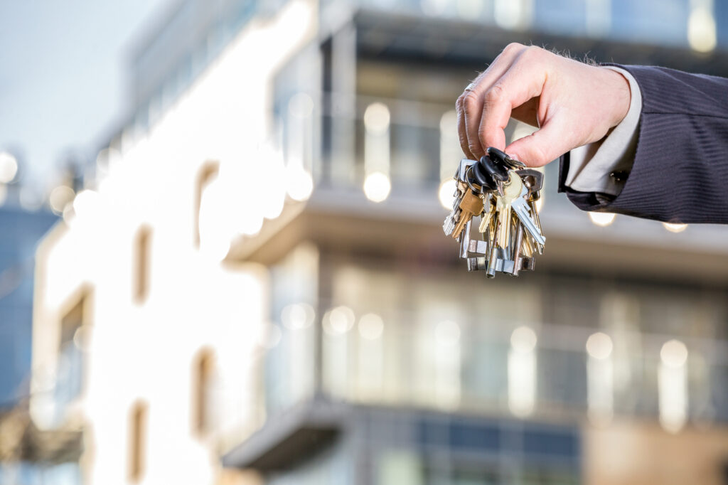 Property Management and Rent to Rent Services in Manchester and Stoke - a bunch of keys to rental properties are held out in front of an HMO